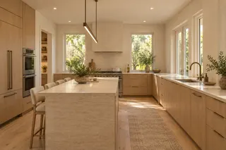 Fulton House — Kitchen · the stone island and integrated oak cabinetry