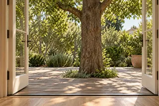 Fulton House — Family room · French doors opening to the tree courtyard
