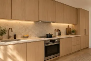 Fulton House — ADU kitchen · a complete cooking space within the smaller dwelling