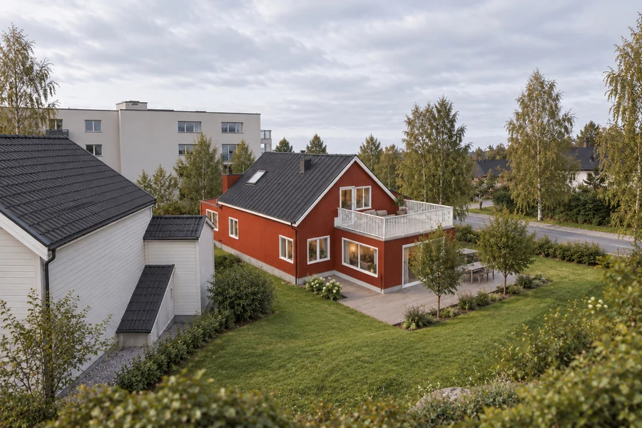 Trondheim Residence — Garden view · red timber, white detailing and the terrace edge